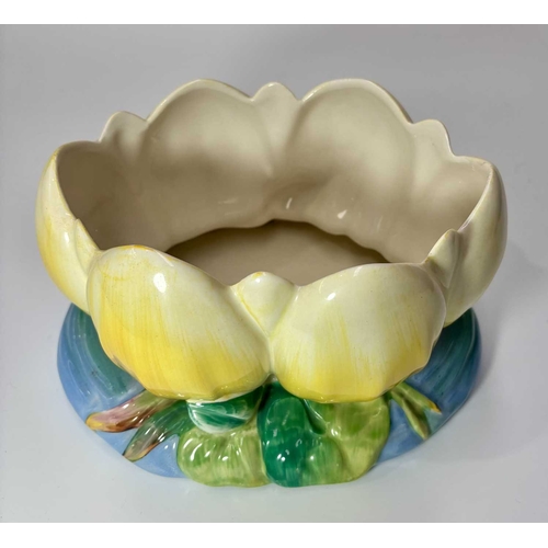 90 - Clarice Cliff for Newport Pottery, a Waterlily moulded bowl, painted yellow, printed marks, 22.5cm l... 