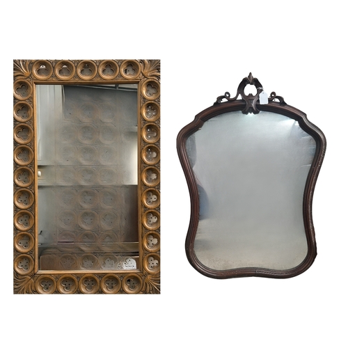 594 - A carved beech-framed wall mirror, the frame with cut-out trefoil shapes in roundels, height 88.5cm,... 
