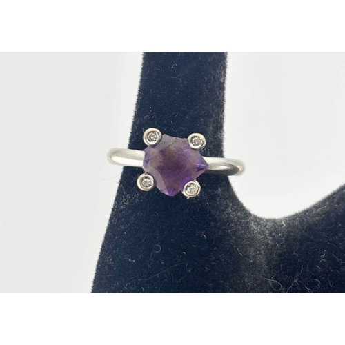454 - An amethyst and diamond ring, stamped 750, ring size N, amethyst AF, 7.9g