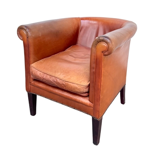 547 - A Laura Ashley 'Osbourne' brown tan leather, tub armchair in a club style with brass studding, legs ... 