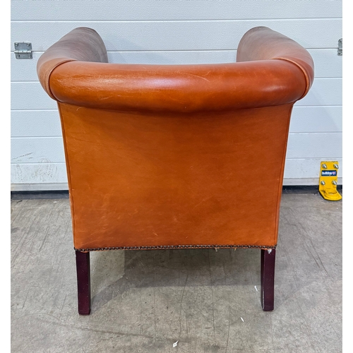 547 - A Laura Ashley 'Osbourne' brown tan leather, tub armchair in a club style with brass studding, legs ... 