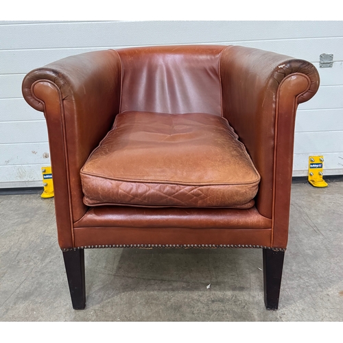 547 - A Laura Ashley 'Osbourne' brown tan leather, tub armchair in a club style with brass studding, legs ... 