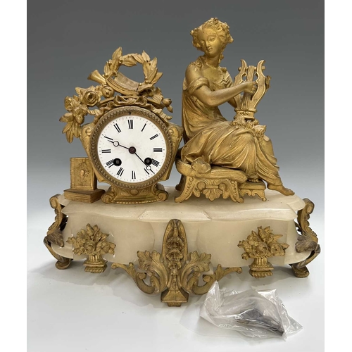 272 - A French mantle clock, 19th century, alabaster base surmounted with a finely cast and gilded female ... 