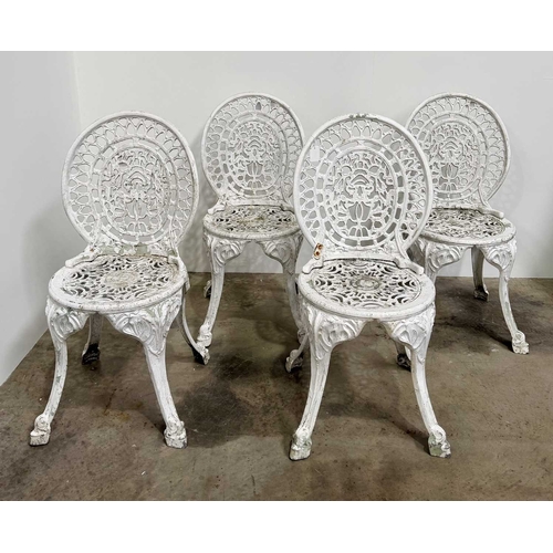 673 - Cast metal bistrot table and four chairs in the Victorian style with cast fretwork pattern, h: 70.5c... 