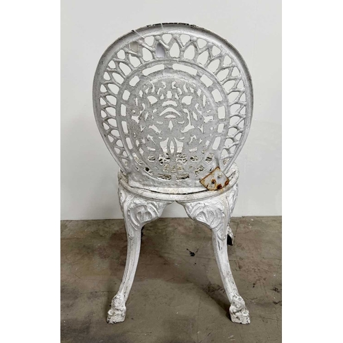 673 - Cast metal bistrot table and four chairs in the Victorian style with cast fretwork pattern, h: 70.5c... 