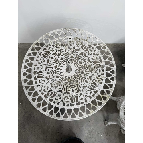 673 - Cast metal bistrot table and four chairs in the Victorian style with cast fretwork pattern, h: 70.5c... 