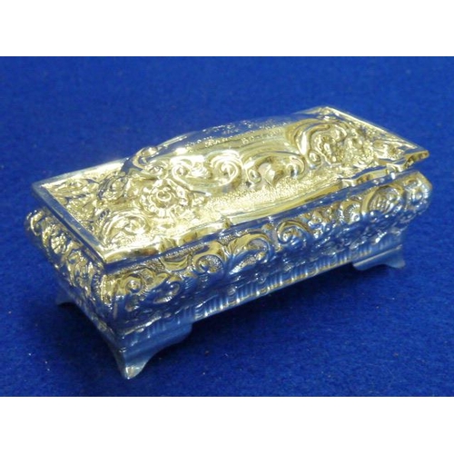 223 - A fine quality hallmarked silver rectangular Box and hinged Cover profusely decorated repoussé style... 