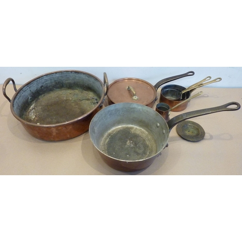 125 - A good selection of 19th century copperware to include a two-handled preserve pan and a heavy taperi... 