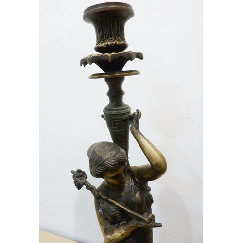 139 - A large pair of decorative bronze Classical figured candle stands