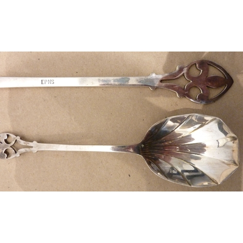 164 - A circa 1900 boxed set of Arts and Crafts style silver-plated spoons