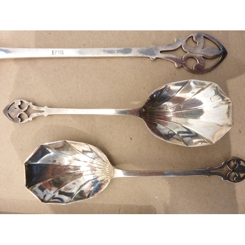 164 - A circa 1900 boxed set of Arts and Crafts style silver-plated spoons