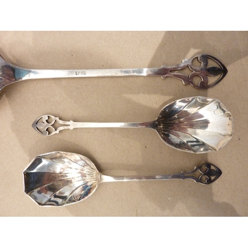 164 - A circa 1900 boxed set of Arts and Crafts style silver-plated spoons