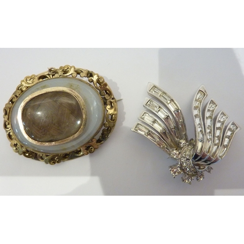 223 - An ornate Victorian mourning brooch together with a costume brooch marked Boucher (boxed)