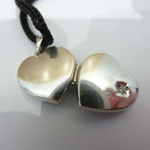 288 - A 9-carat white gold heart-shaped pendant locket (boxed)