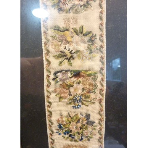 333 - A Hogarth framed and glazed needlework depicting urns, cornucopia and various flowers