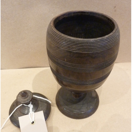 355 - A late 19th century turned lignum vitae vase and cover in the form of a wassail bowl