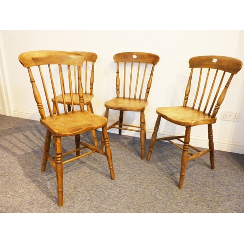 463 - A set of four early 20th century kitchen-style chairs; shaped elm seats, slightly splayed turned leg... 