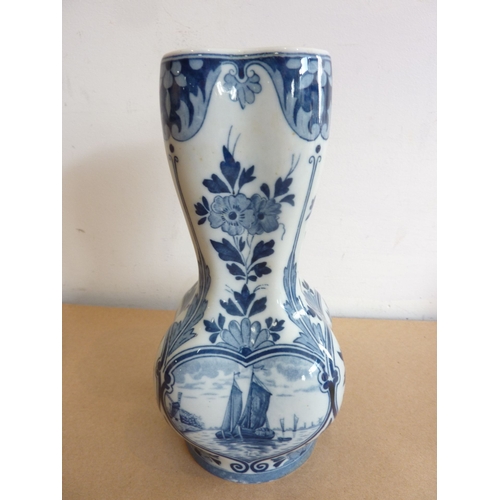 56 - A blue and white Delft vase together with two Carnival glass bowls