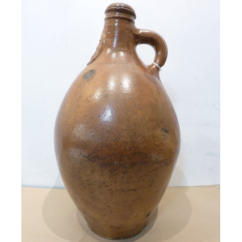 78 - A large old stoneware jug with the face of Cardinal Bellarmine to the neck