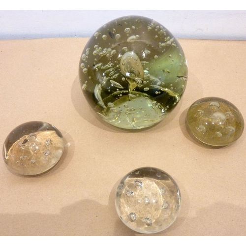 90 - A large Victorian glass dump together with three smaller Victorian paperweights