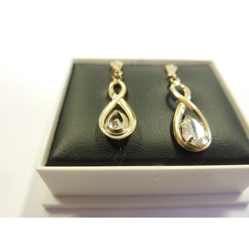 184 - A pair of 9-carat gold stone-set earrings