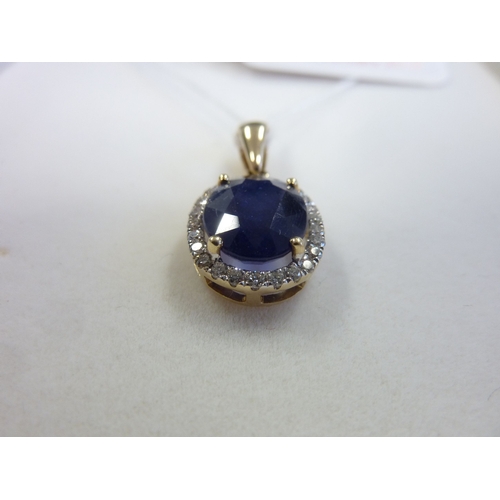 189 - A sapphire and diamond cluster pendant (matching the previous lot)