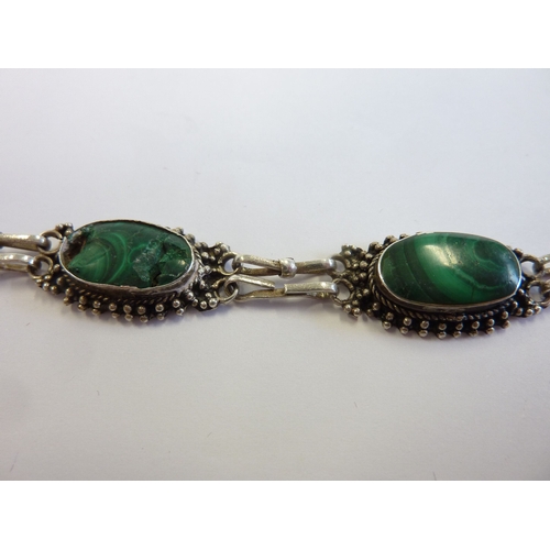 193 - A silver bracelet set with oval cabouchon malachite stones within a burr-wood presentation case