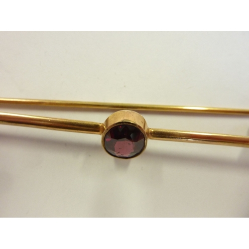 200 - A 9-carat gold and garnet bar brooch