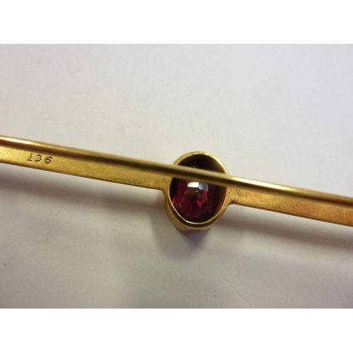 200 - A 9-carat gold and garnet bar brooch