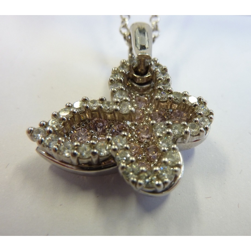 207 - A ladies silver pendant set with various stones in the shape of a butterfly, upon a silver chain and... 