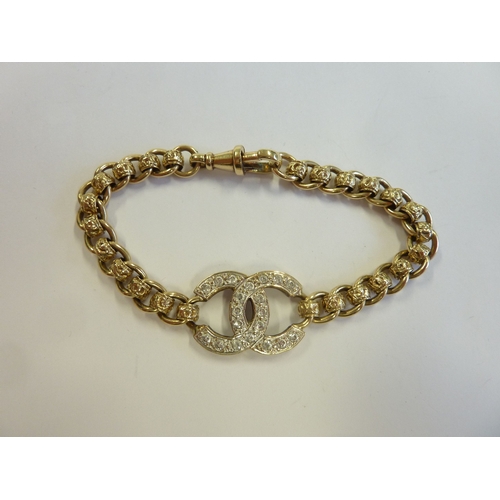 211 - A heavy 9-carat gold 'Chanel' stone-set bracelet