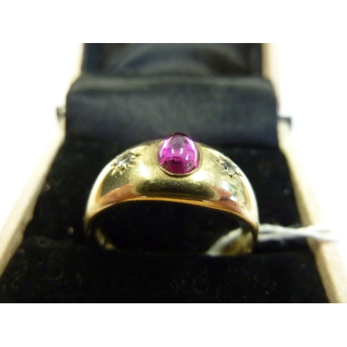 217 - A 19th century gold ring set with cabouchon ruby and diamonds