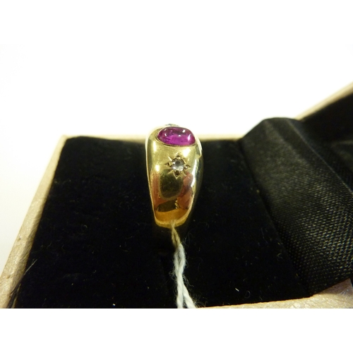 217 - A 19th century gold ring set with cabouchon ruby and diamonds