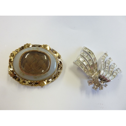 223 - An ornate Victorian mourning brooch together with a costume brooch marked Boucher (boxed)