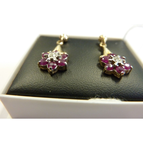 240 - A pair of 9-carat ruby and diamond drop earrings