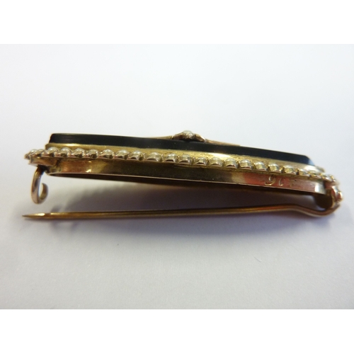 248 - A Victorian gold, onyx and seed pearl bar brooch