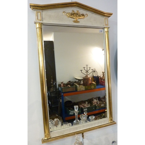 428 - An ornate Classical style gilt and marble effect framed wall hanging mirror, the plate flanked by tw... 