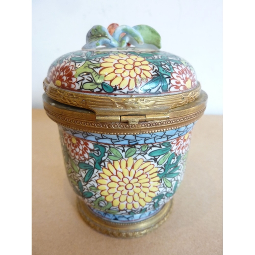 77 - A gilt-metal-mounted ceramic circular inkwell hand-decorated in enamels with chrysanthemums etc.