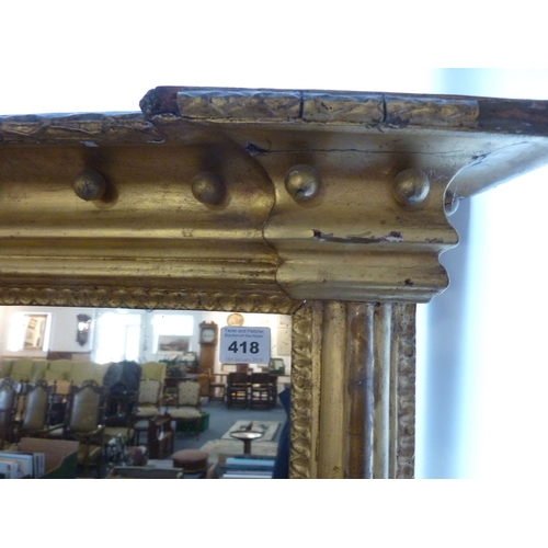 418 - A large early 19th century three-plate gilt-framed overmantel looking glass, 152cm wide x 65cm high