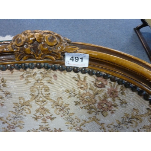 491 - A pair of carved wood and upholstered Louis XV style fauteuils