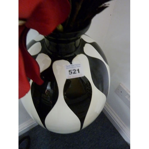 521 - A large and decorative black-and-white elongated baluster vase together with a flower display etc.