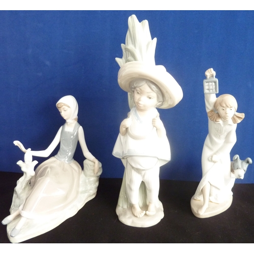 16 - Three Lladro figurines: boy wearing sombrero carrying rushes (28cm), seated girl with dove (Lladro 4... 