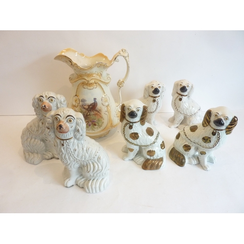 2 - Three pairs of hand-decorated Staffordshire spaniels together with a large Edwardian pitcher decorat... 