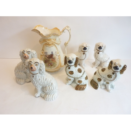 2 - Three pairs of hand-decorated Staffordshire spaniels together with a large Edwardian pitcher decorat... 