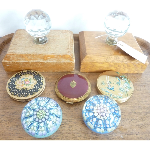 57 - A mixed lot to include two cut-glass-and-oak door stops, two millefiori-style Perthshire paperweight... 