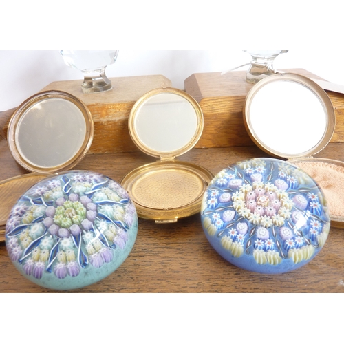 57 - A mixed lot to include two cut-glass-and-oak door stops, two millefiori-style Perthshire paperweight... 