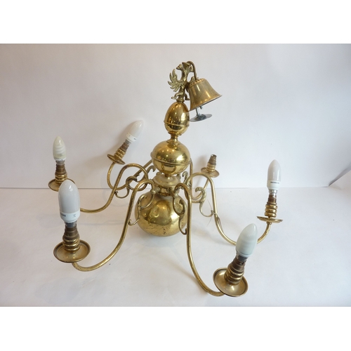 69 - A large six-light ceiling hanging brass chandelier