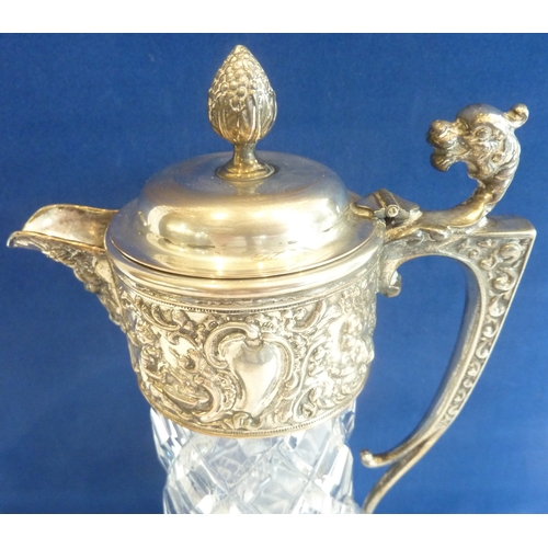 58 - A heavy crystal and silver-plated claret jug