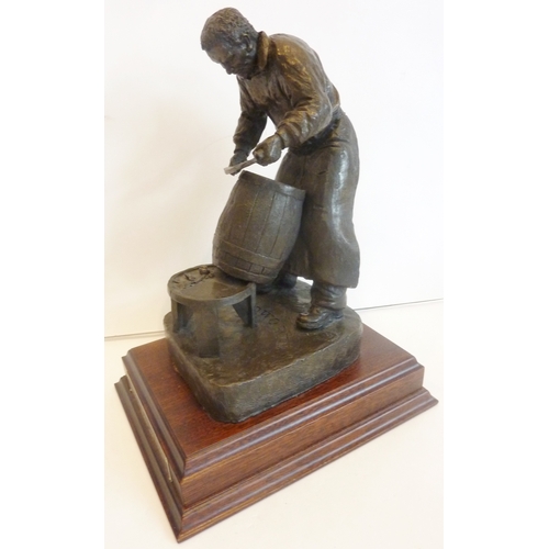 76 - A cold-cast bronze figure of a cooper; the wooden stand with plaque inscribed 'The Wadworth 6X Maide... 