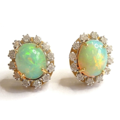 113 - A pair of fine quality 18-carat opal and diamond cluster earrings